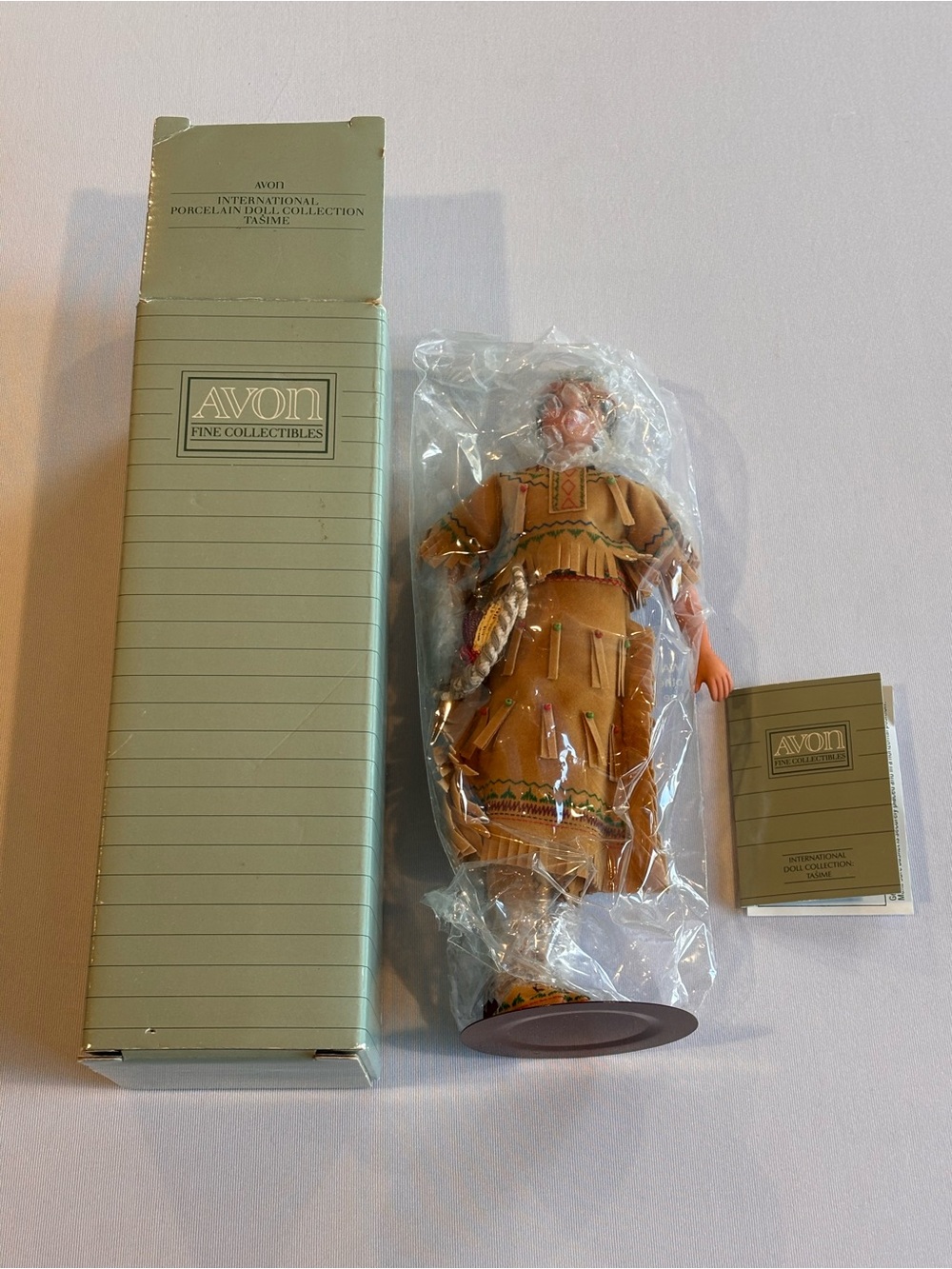 Avon Tasime Porcelain Doll in Tan Dress with Green & Red Accents